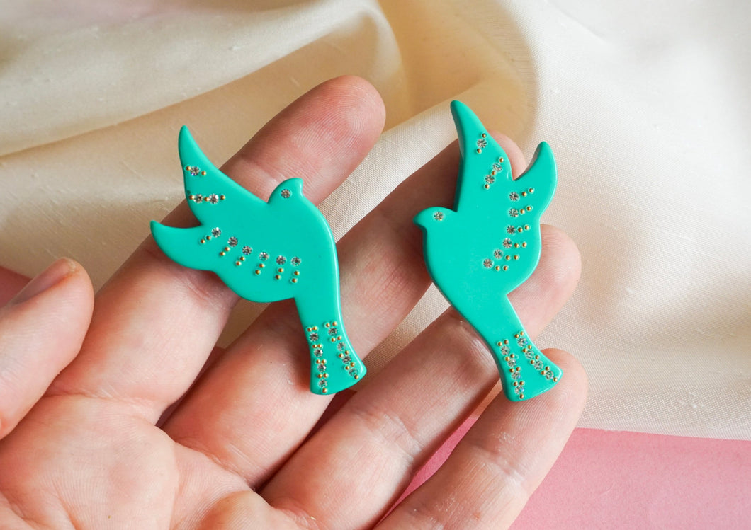 Green doves and rhinestone clips
